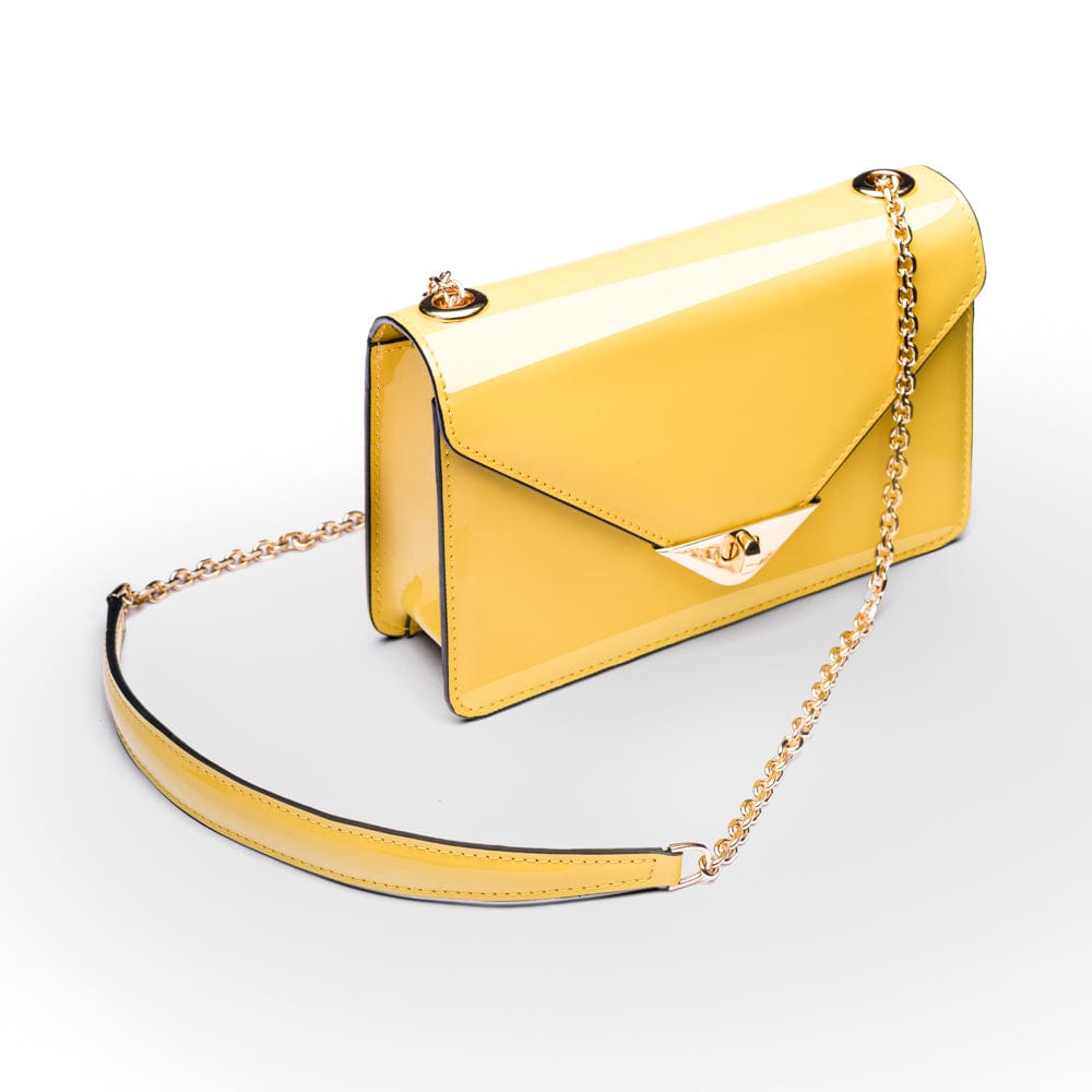 Small leather envelope chain bag, yellow patent, side view