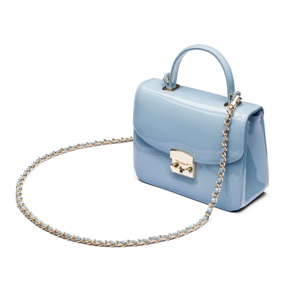 Small leather top handle bag, patent baby blue, side view