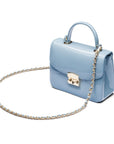 Small leather top handle bag, patent baby blue, side view