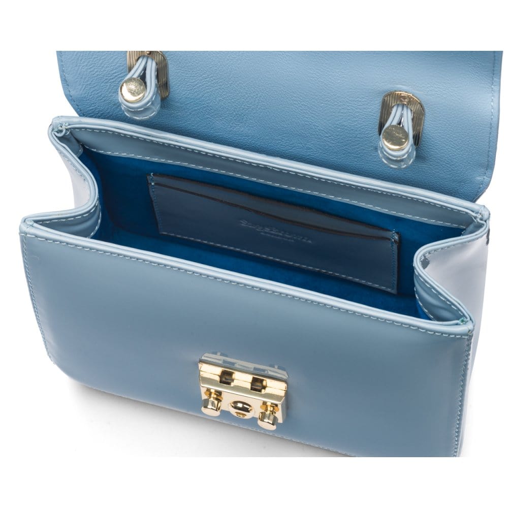 Small leather top handle bag, patent baby blue, inside