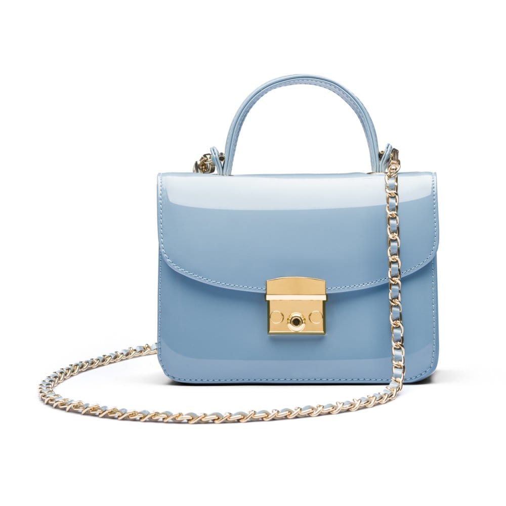 Small leather top handle bag, patent baby blue, with chain strap