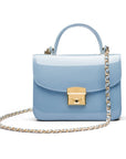 Small leather top handle bag, patent baby blue, with chain strap