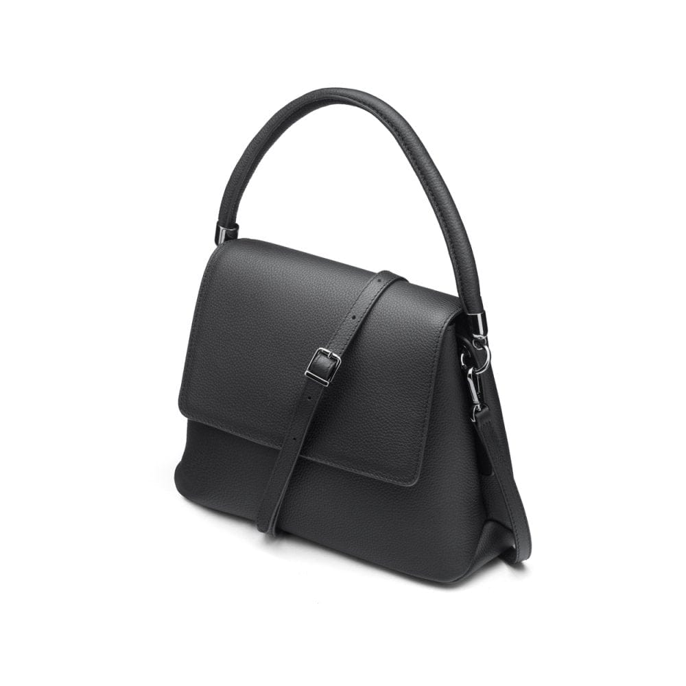 Leather handbag with flap over lid, black, side view