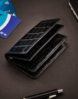 Leather bifold card wallet, black croc, lifestyle