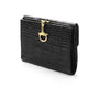 Leather purse with brass clasp, black croc, front view