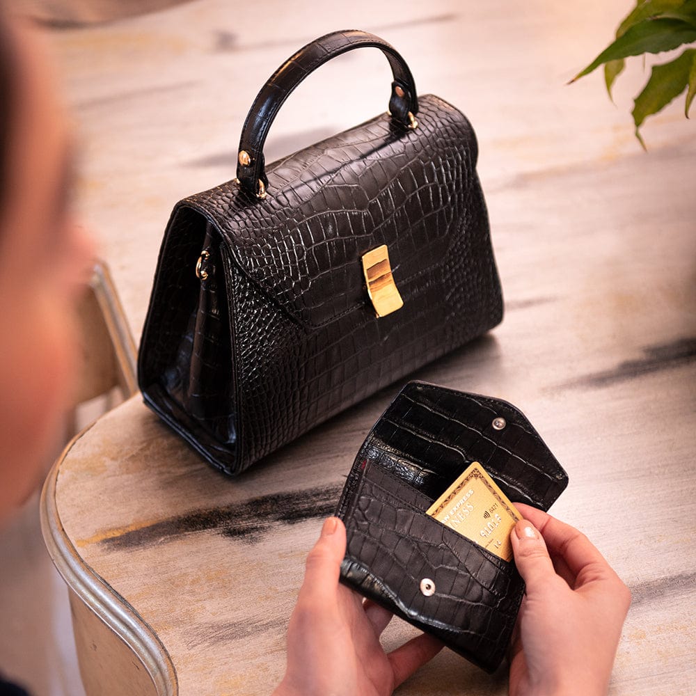 Small leather concertina purse, black croc, lifestyle