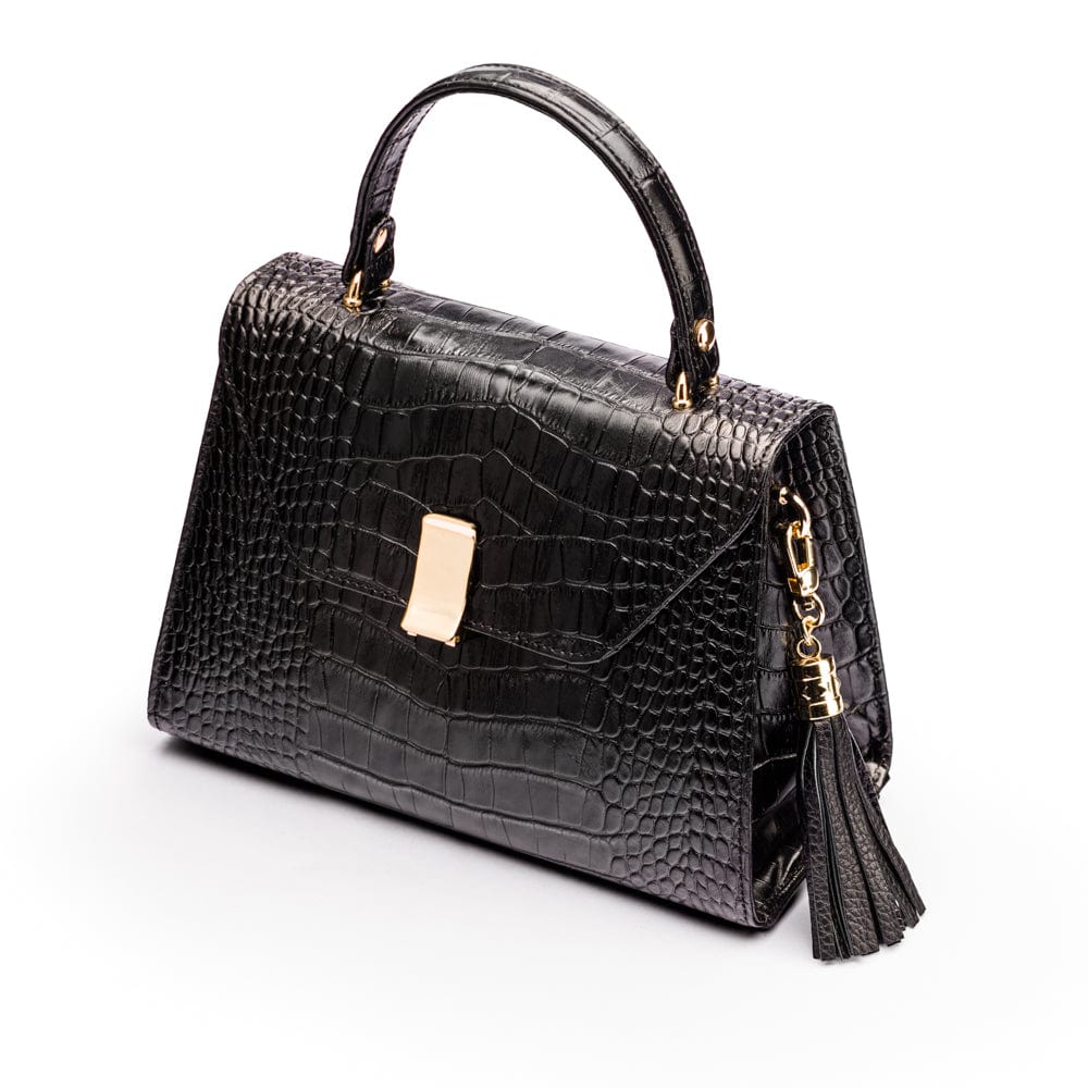 Decorative leather tassel, black, on a bag