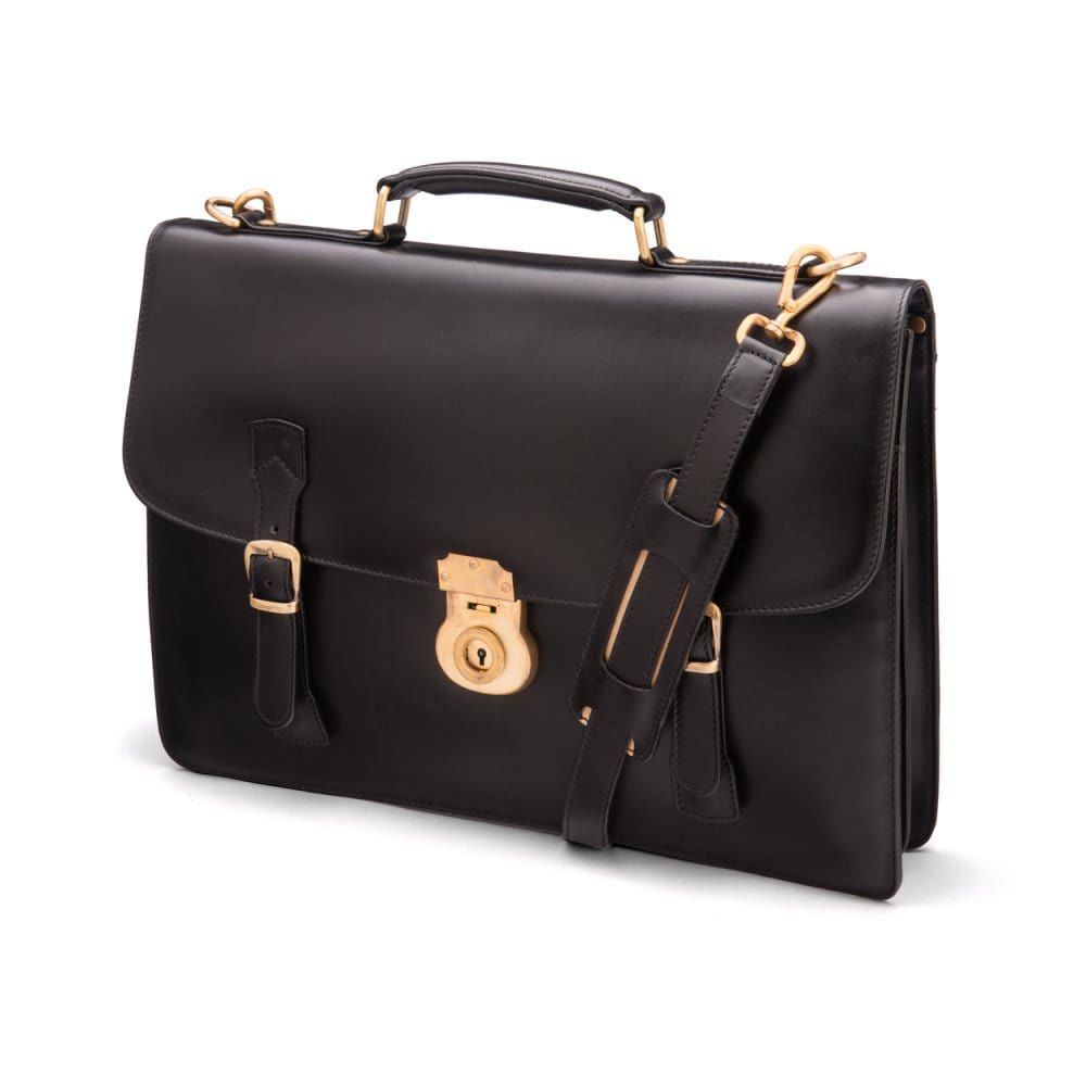 Leather satchel briefcase with straps and brass lock, black, side