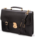 Leather satchel briefcase with straps and brass lock, black, side