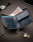 Men's leather zip wallet with coin purse, black with cobalt, lifestyle