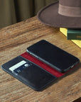 Leather iPhone XR wallet case, black with red, lifestyle