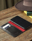 Leather iPhone 11 Pro Max wallet case, black with red, lifestyle