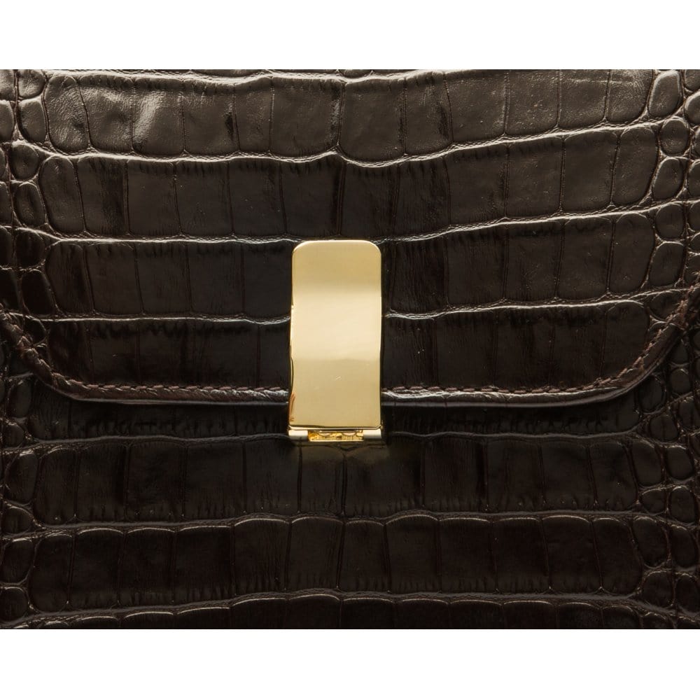 Leather top handle bag, brown croc, lock closeup