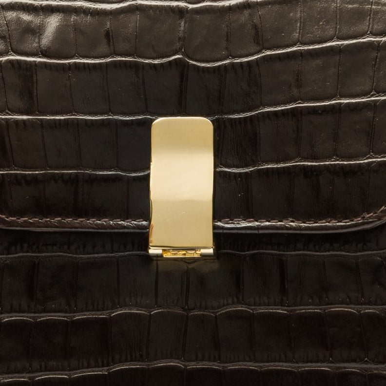 Leather top handle bag, brown croc, lock closeup