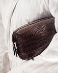 Leather wash bag, brown croc, lifestyle view