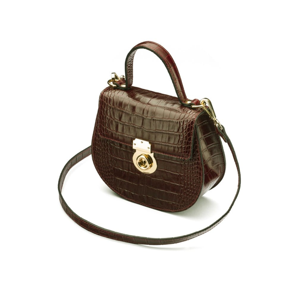 Leather rounded bottom top handle bag, brown croc, side