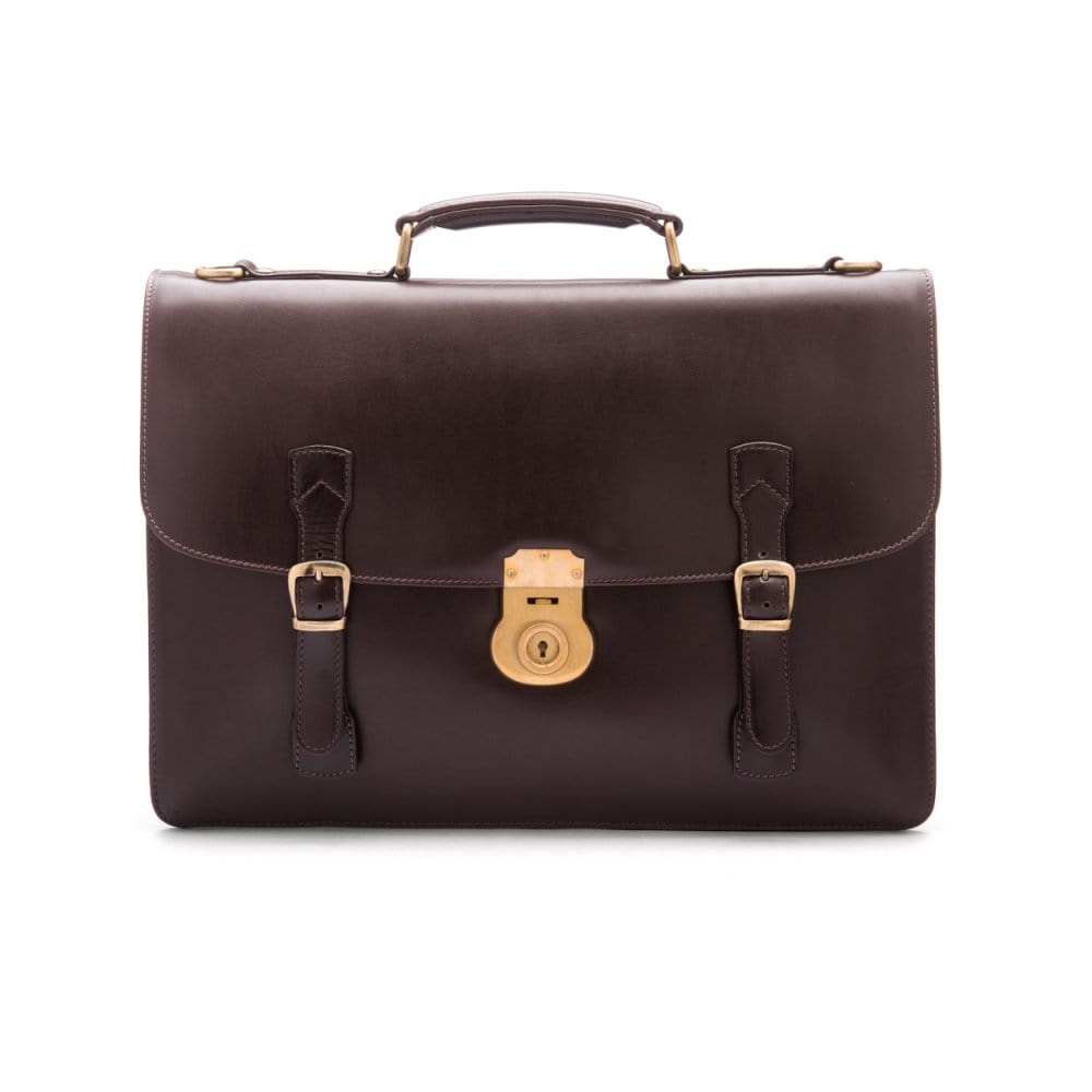 Leather satchel briefcase with straps and brass lock, brown, front