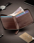 Men's leather wallet with zip around closure, brown, lifestyle