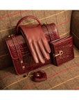 Leather purse with brass clasp, burgundy croc, lifestyle