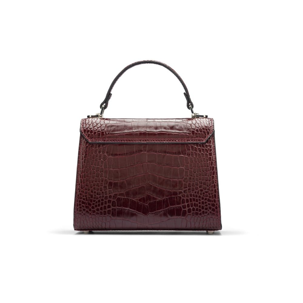 Mini Burnett small top handle bag, burgundy croc, back view