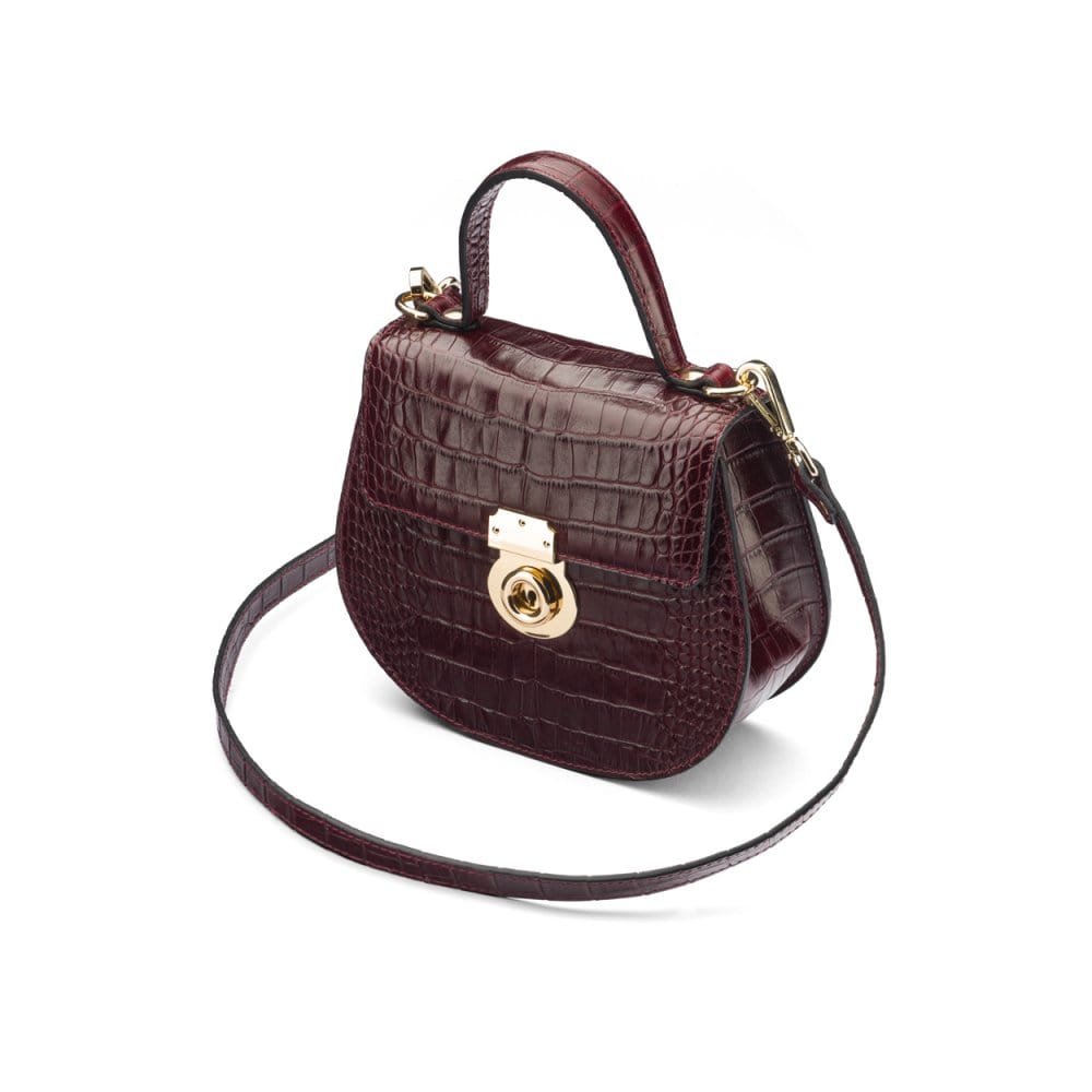 Leather rounded bottom top handle bag, burgundy croc, side