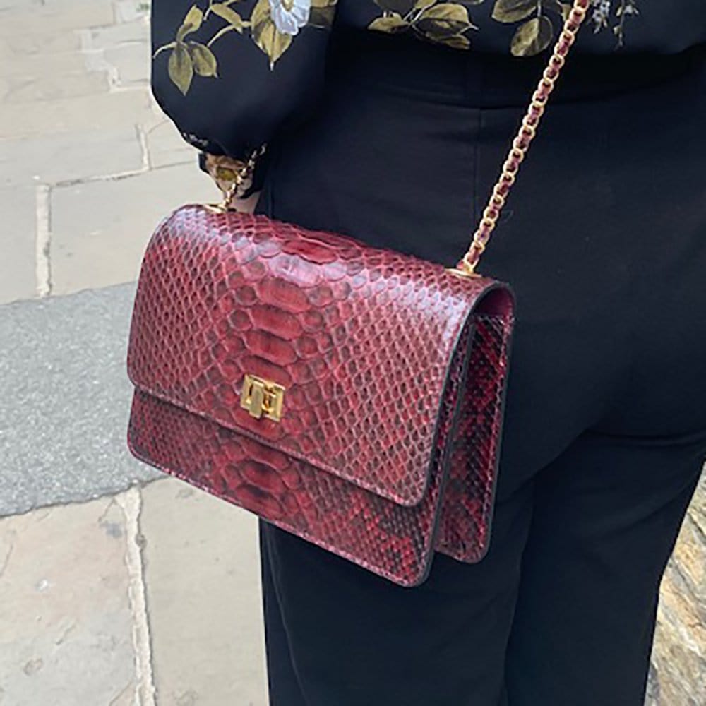 Leather chain bag, burgundy python, side view