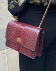 Leather chain bag, burgundy python, side view