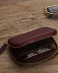 Small leather zip around coin purse, burgundy, lifestyle