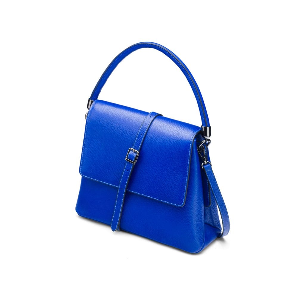 Leather handbag with flap over lid, cobalt blue, side view