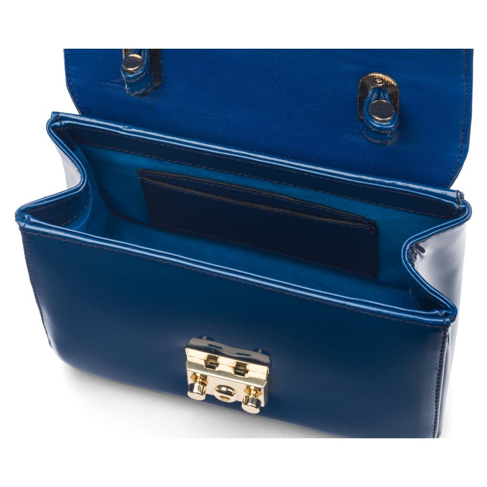 Small leather top handle bag, cobalt patent, inside