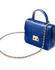 Small leather top handle bag, cobalt croc, side