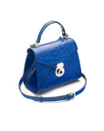 Mini Burnett small top handle bag, cobalt croc, side view