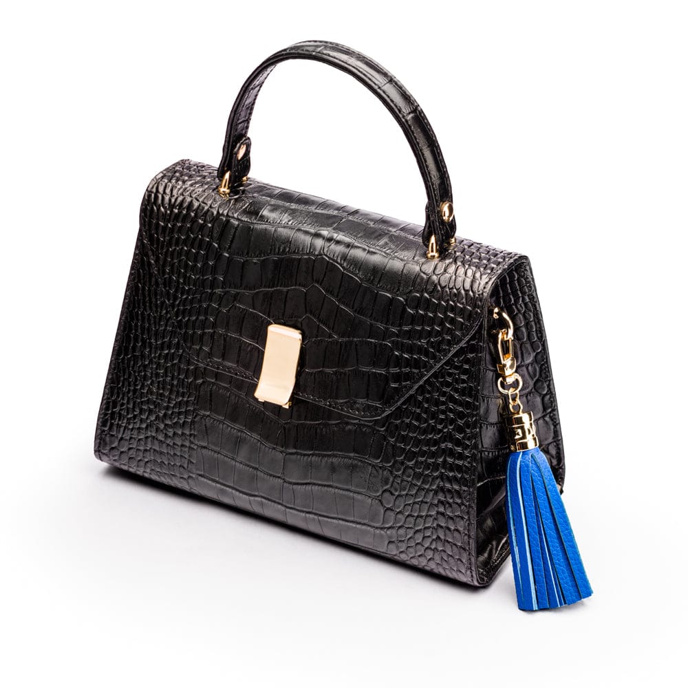 Decorative leather tassel, cobalt, on a bag