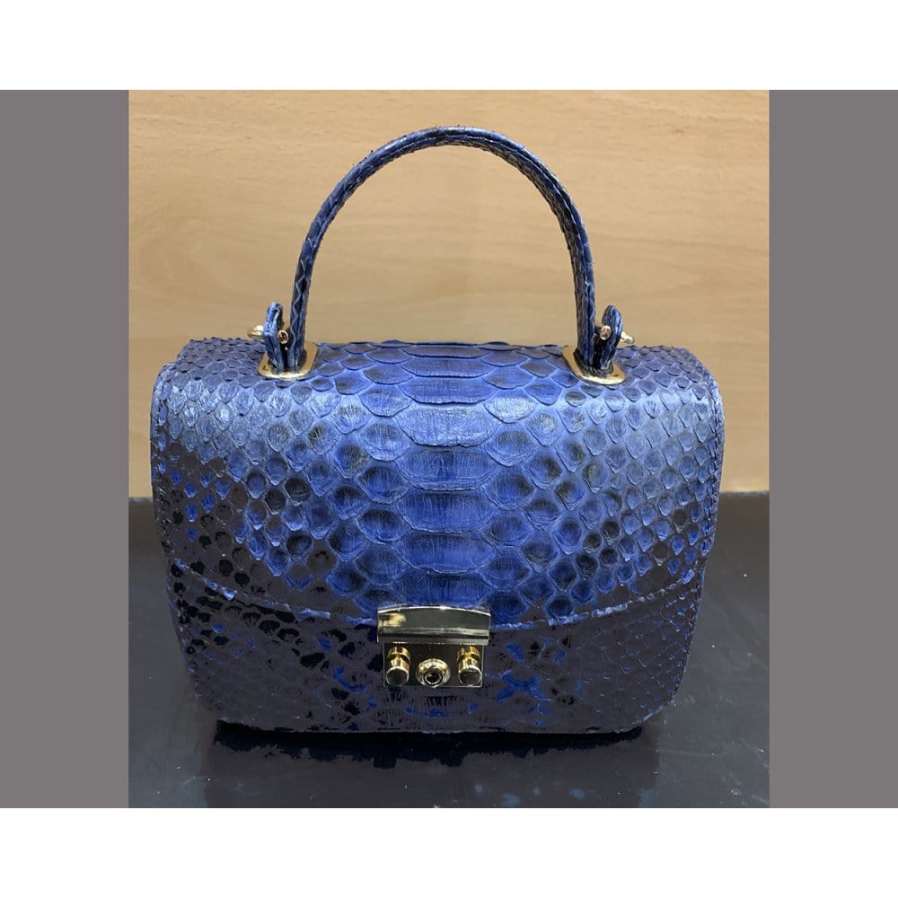 Small real python top handle bag, cobalt, front