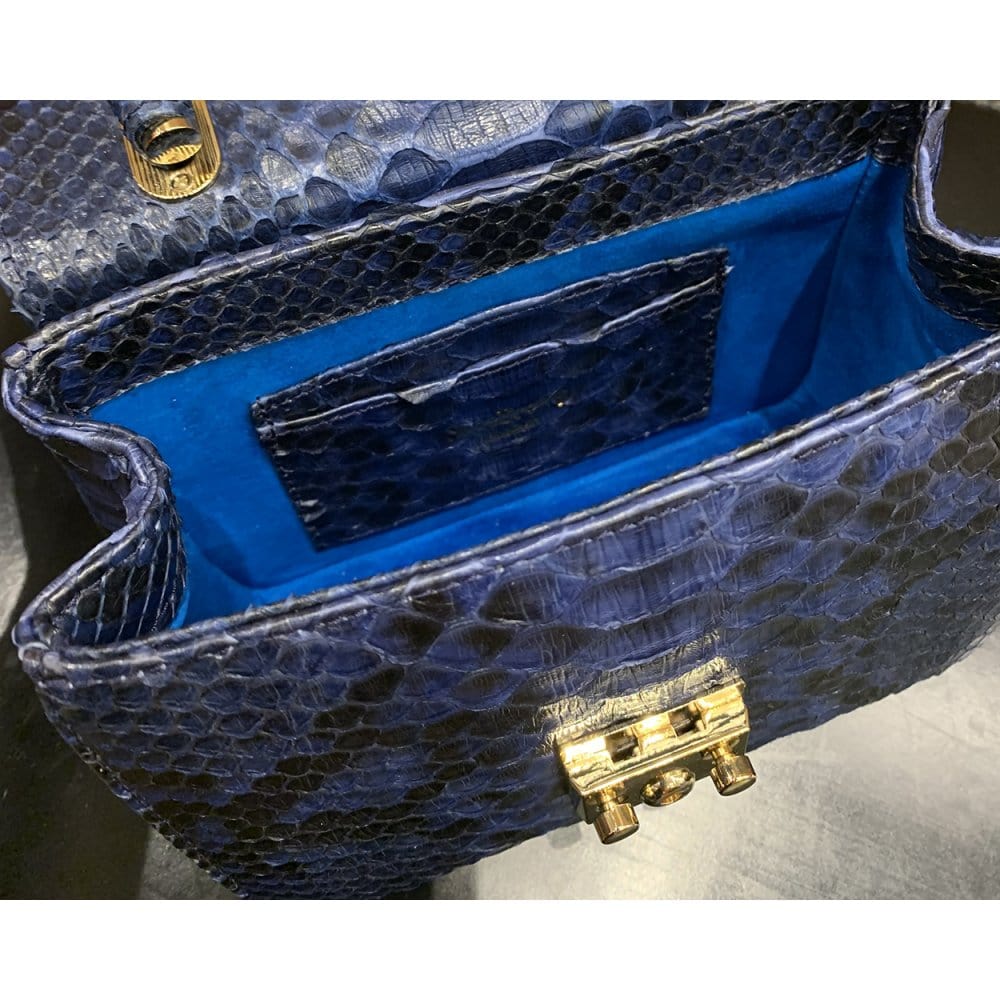 Small real python top handle bag, cobalt, inside