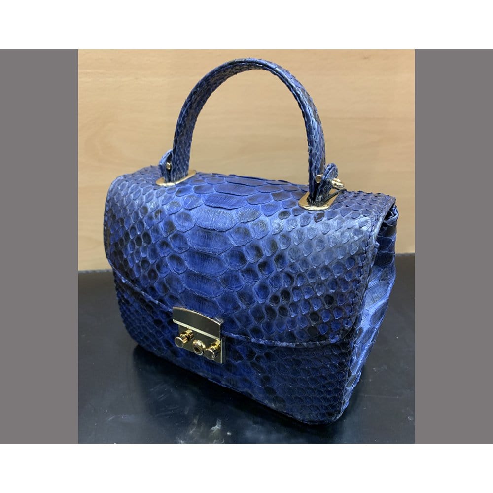 Small real python top handle bag, cobalt, side