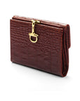 Leather purse with brass clasp, dark tan croc, front view