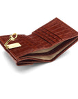 Leather purse with brass clasp, dark tan croc, inside