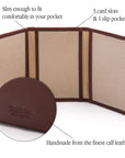 Leather tri-fold travel card holder, dark tan with cream, features