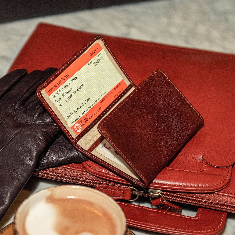 Tri-fold leather travel card wallet, dark tan, lifestyle