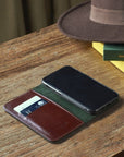 Leather iPhone 11 Pro wallet case, dark tan, lifestyle