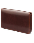 Leather business card holder with magnetic closure, dark tan with green, front