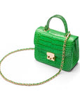 Small leather top handle bag, emerald croc, side