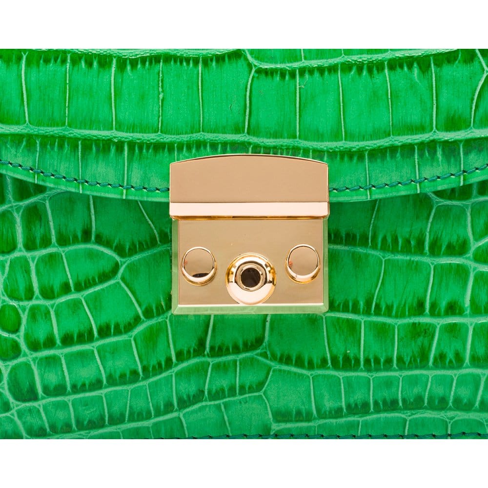 ESmall leather top handle bag, emerald croc, lock close up