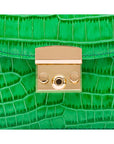 ESmall leather top handle bag, emerald croc, lock close up