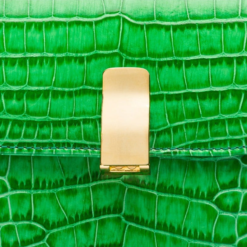 Leather top handle bag, emerald green croc, lock close up