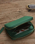 Small leather zip around coin purse, emerald green, lifestyle