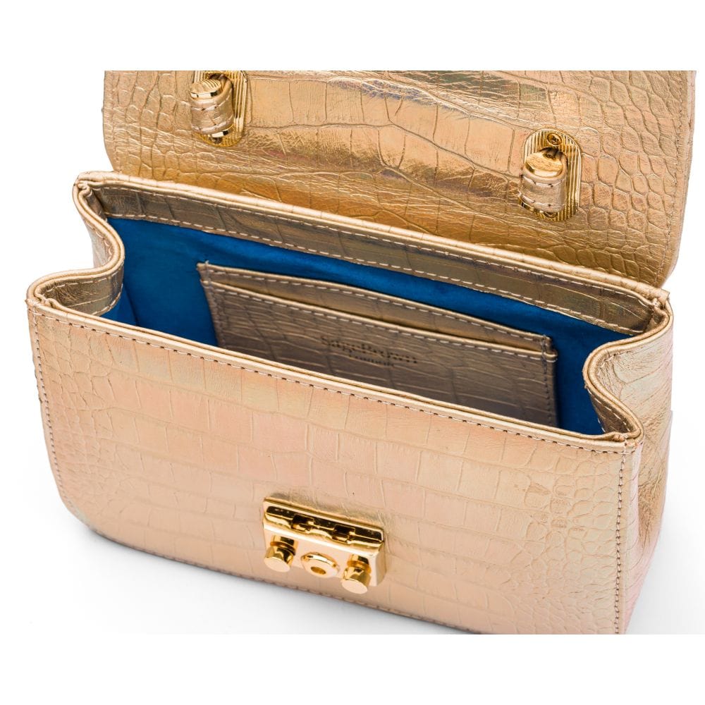 Small leather top handle bag, gold croc, inside