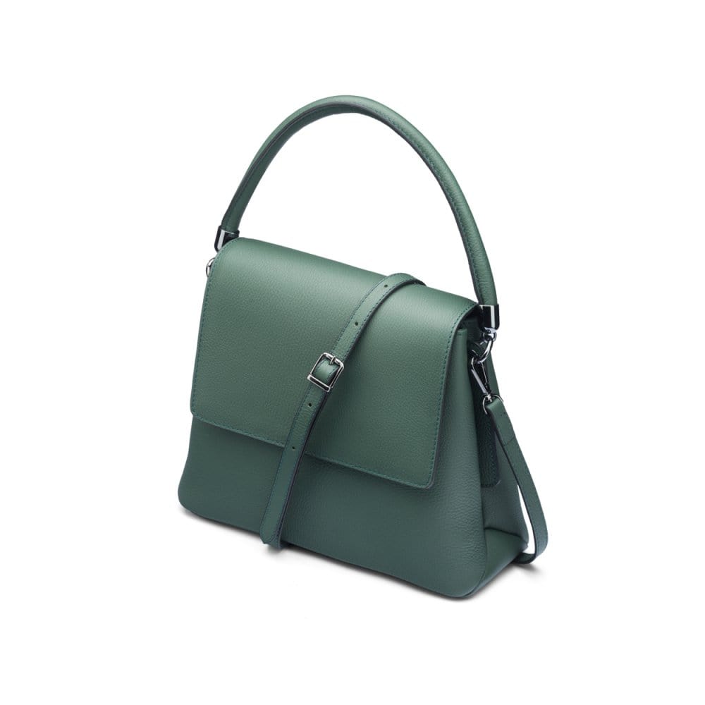 Leather handbag with flap over lid, green, side view