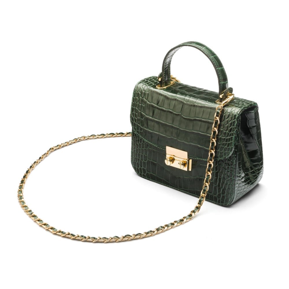 Small leather top handle bag, green croc, side